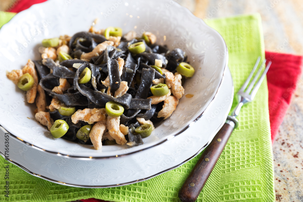Black ink pasta with chicken and green olives Black ink pasta with chicken and green olives