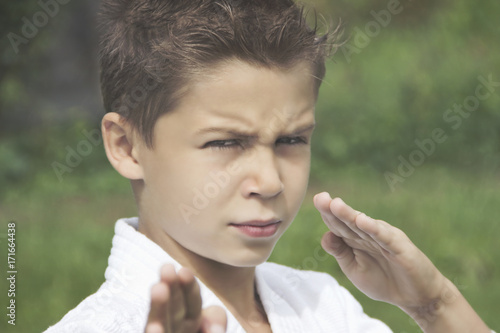 Portrait of a serious boy in a kimono