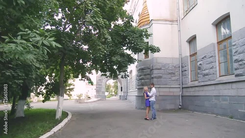 Wallpaper Mural loving young couple walking around town man in white shirt and girl in blue dress Torontodigital.ca