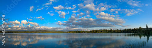 Fototapeta Naklejka Na Ścianę i Meble -  natural reflections on a lake and beautiful clouds.