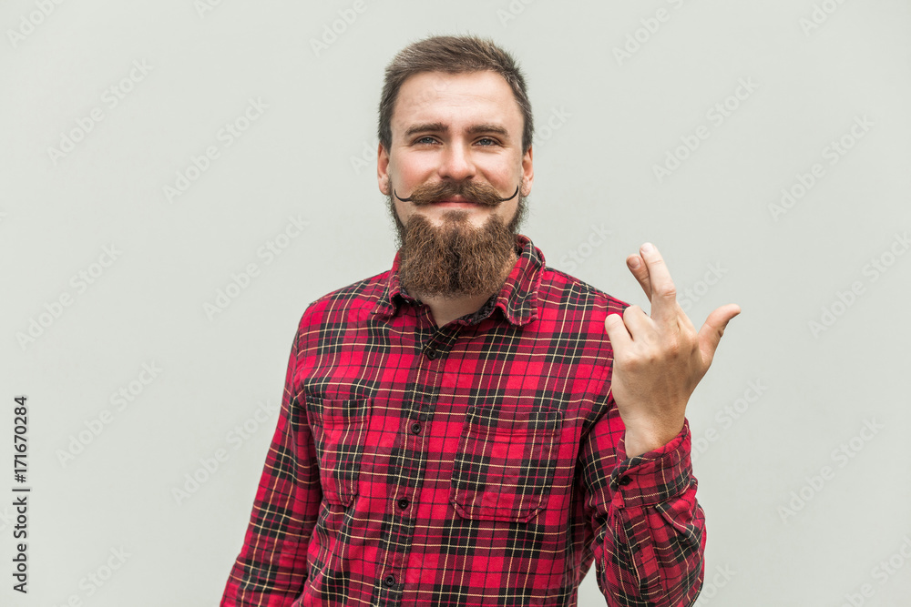 Closeup portrait hopeful beautiful bearded man crossing his fingers, , hoping, asking best isolated on gray background Closeup portrait hopeful beautiful bearded man crossing his fingers, , hoping, asking best isolated on gray background