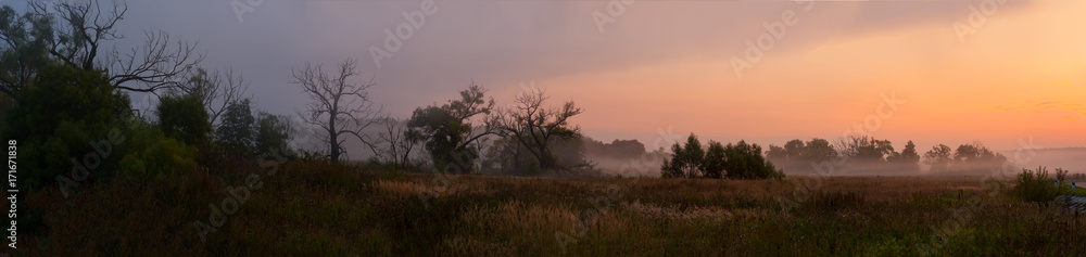 panorama of the misty sunrise of the gentle colors of the nature of the Russian forest-steppe