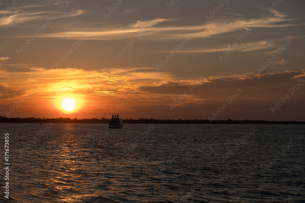Sunset on Sanibel Island Florida with boat Sunset on Sanibel Island Florida with boat