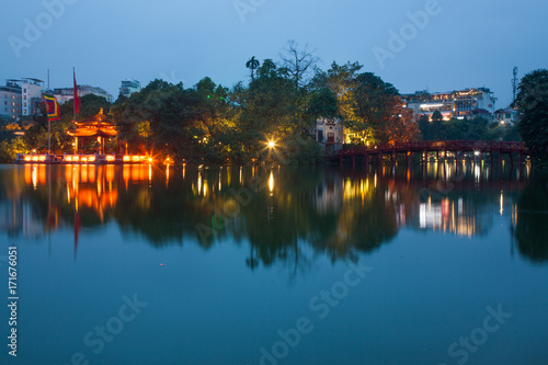 the Buddhist temple of the Jade mountain on the lake Hoankyem in evening twilight