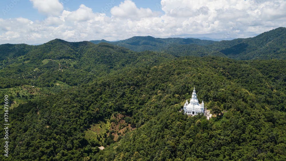 Aerial top view photo from flying drone of the Buddhist temple and fields in  the countryside of Chiang Mai, Northern Thailand