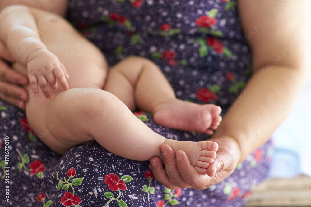 senior woman holding her granddaughter indoor senior woman holding her granddaughter indoor