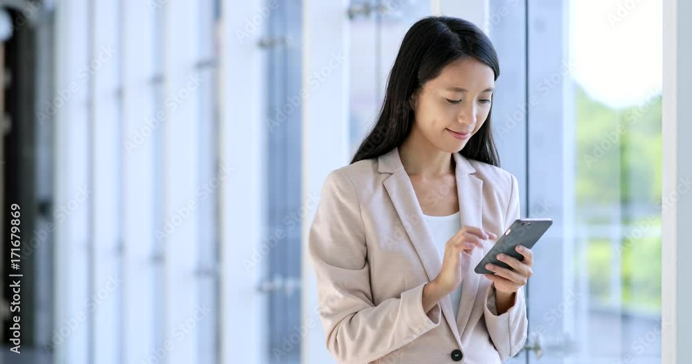 Professional Business woman looking at tablet computer Professional Business woman looking at tablet computer