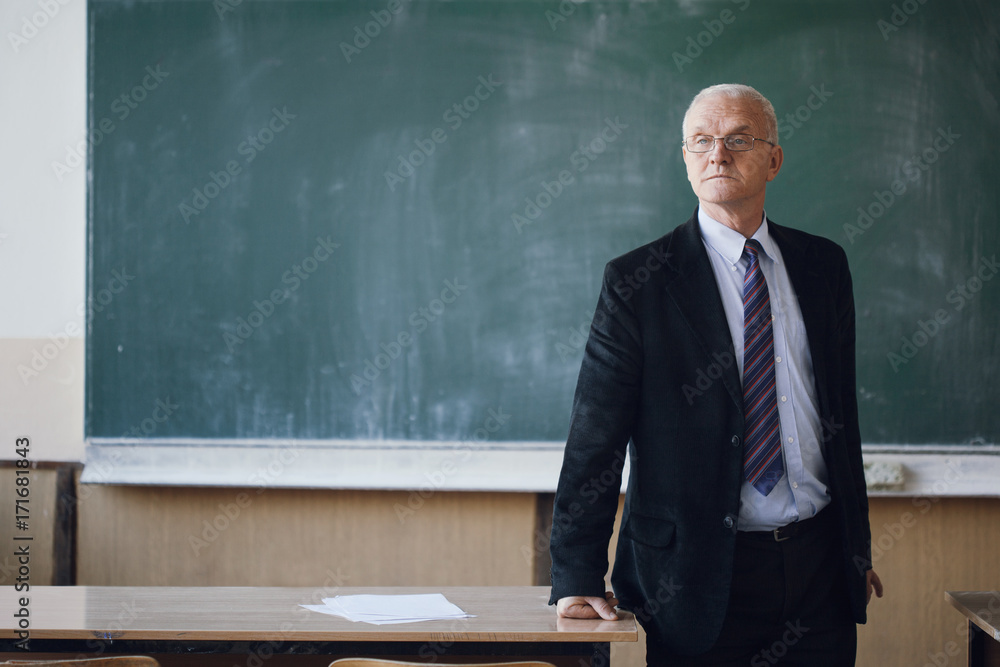 Portrait of a mature professor in a classroom Portrait of a mature professor in a classroom