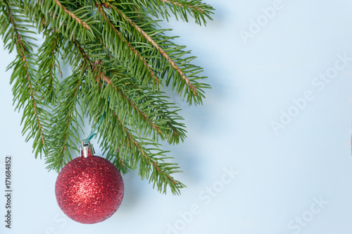 Composition of Christmas decorations on a spruce branch and toning.