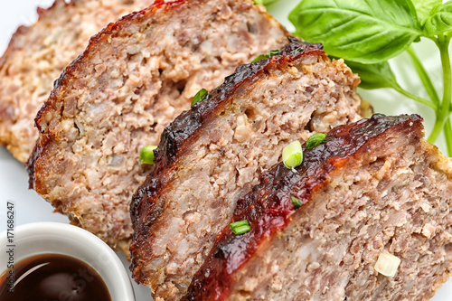 Sliced tasty turkey meatloaf, closeup photo