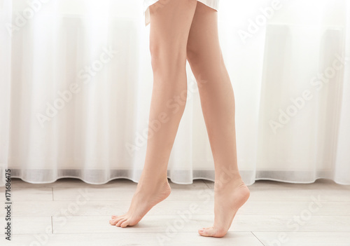 Woman with beautiful legs in room