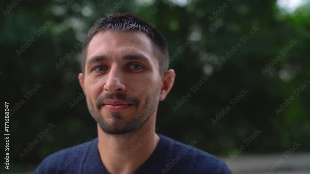 Portrait of a young smiling Caucasian man. Slow motion Portrait of a young smiling Caucasian man. Slow motion