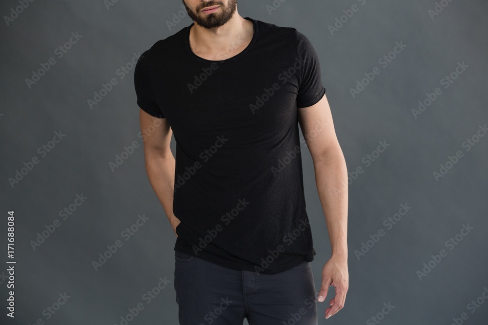 Man posing against grey background Man posing against grey background
