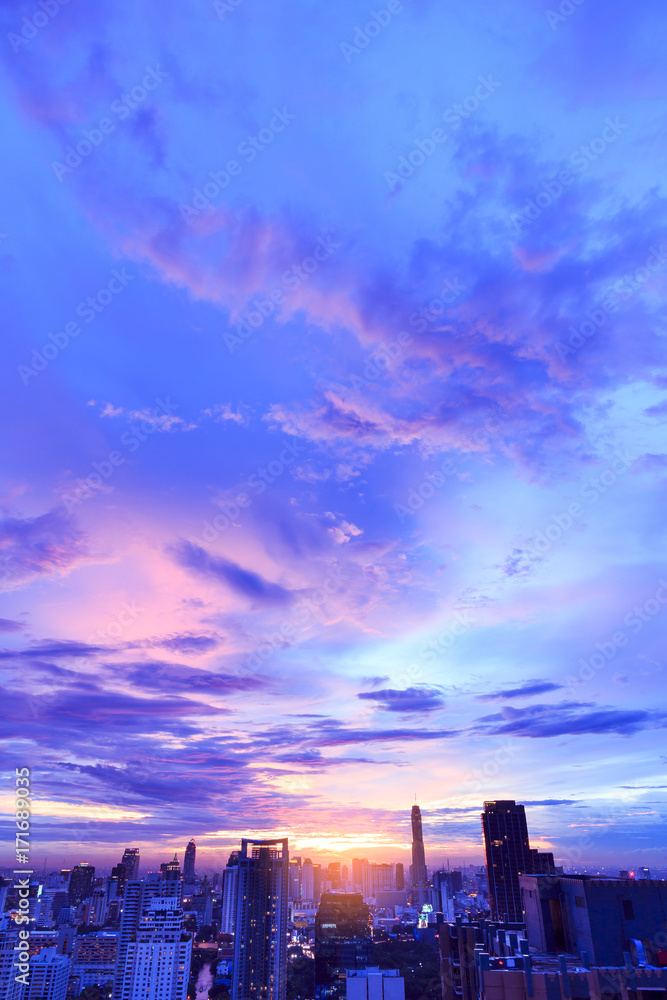 dramatic beautiful purple sky at sunset over cityscape