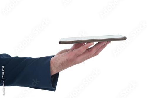 Cropped hand of businessman holding tablet computer