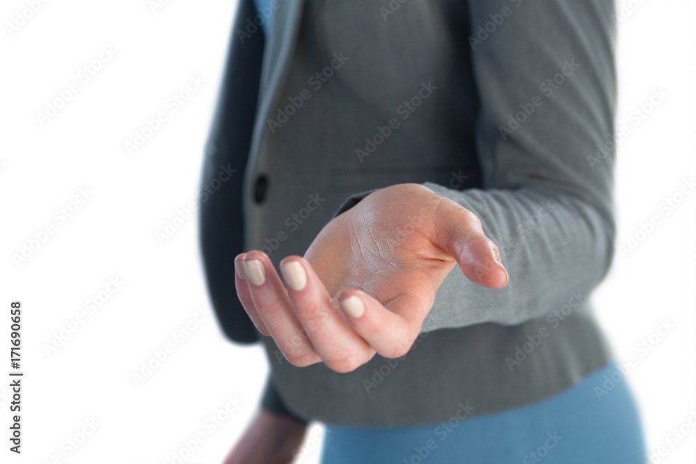 Mid section of businesswoman gesturing against white background