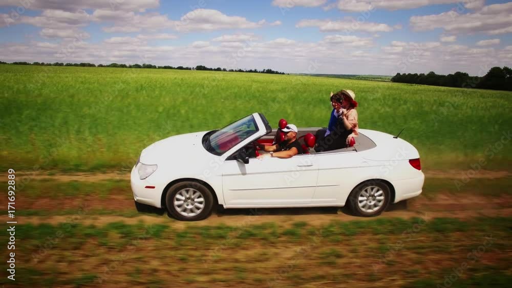 4k Aerial Flying Beside White Convertible Car Driving Along Fields of Wheat 4k Aerial Flying Beside White Convertible Car Driving Along Fields of Wheat