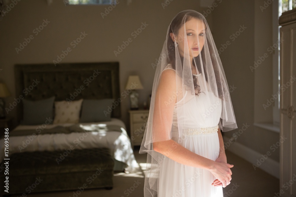 Portrait of bride in wedding dress at home Portrait of bride in wedding dress at home