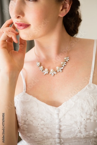 Midsection of beautiful bride wearing necklace