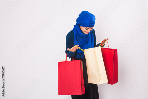 Arab or Muslim woman with shopping bags