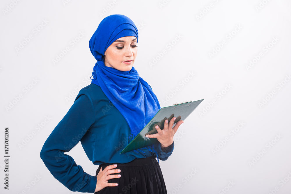 Arab Student holding a folder Arab Student holding a folder
