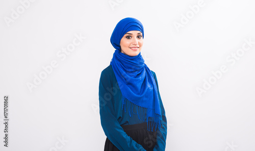Attractive muslim woman on white background