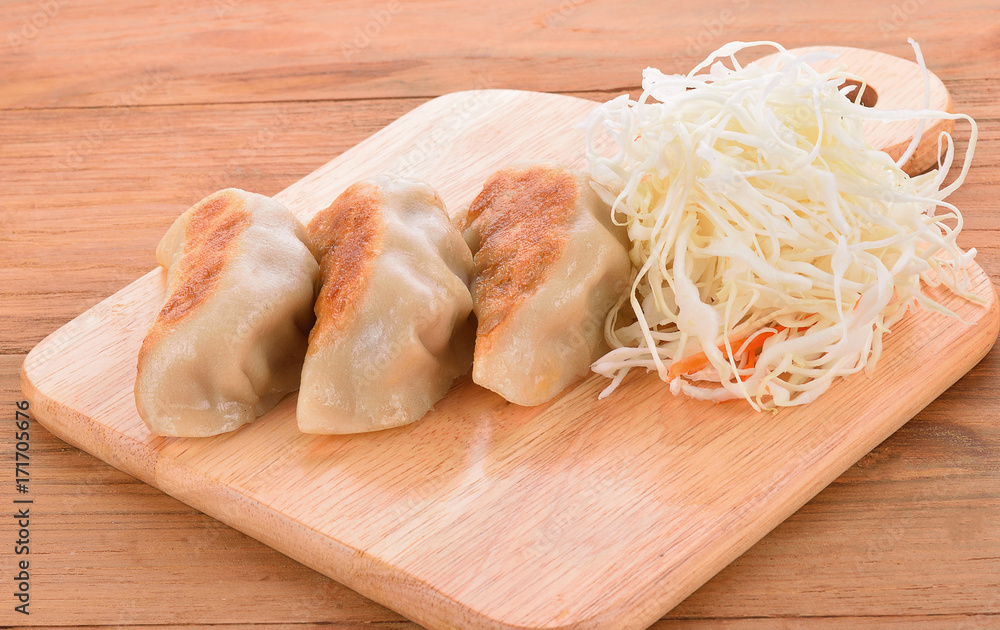 Japanese style dumplings on wooden floor Japanese style dumplings on wooden floor