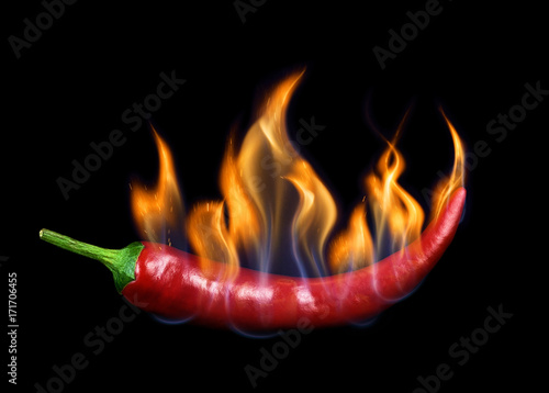 Chili pepper in flame on a black background.