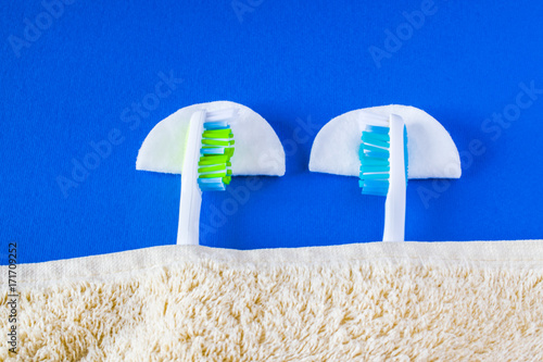 two toothbrushes lie to each other and sleep. photo