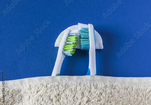 Two toothbrushes lie to each other and sleep. photo