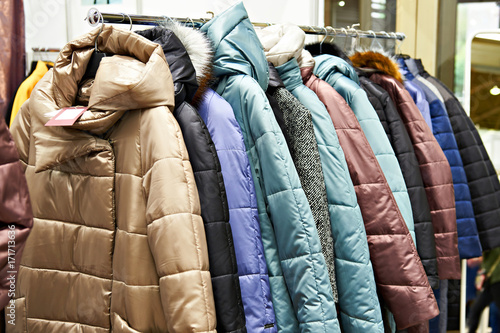 Winter women's jackets on hanger in store