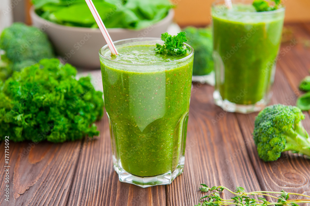Fresh green smoothies in glass with ingredients on the dark rustic wooden table. Healthy, diet, detox lifestyle concept. Selective focus. Copy space. Fresh green smoothies in glass with ingredients on the dark rustic wooden table. Healthy, diet, detox lifestyle concept. Selective focus. Copy space.