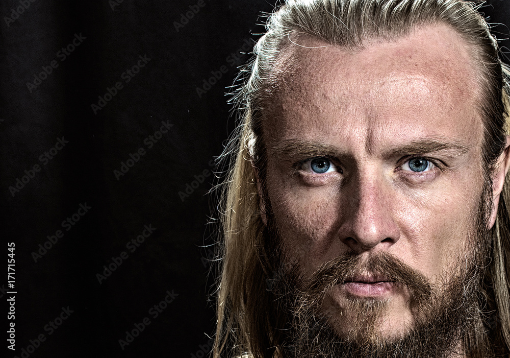 Brutal handsome man face. Close-up blonde nordic brutal man face on black  background. Stock Photo | Adobe Stock