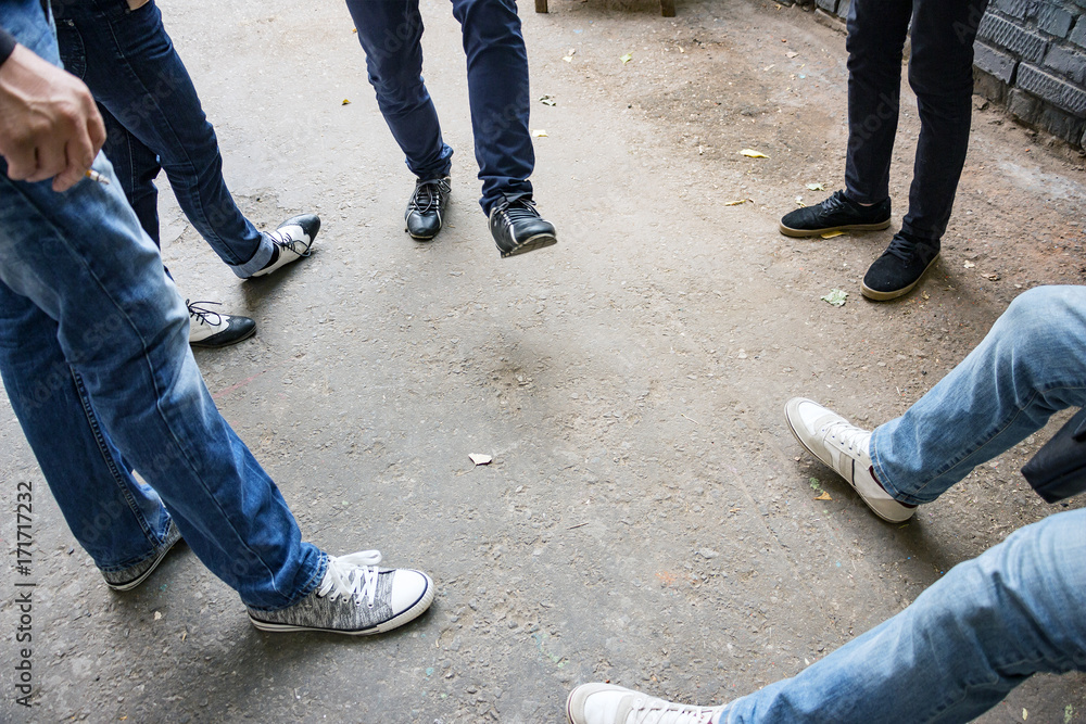 Legs of a group of people standing around Legs of a group of people standing around