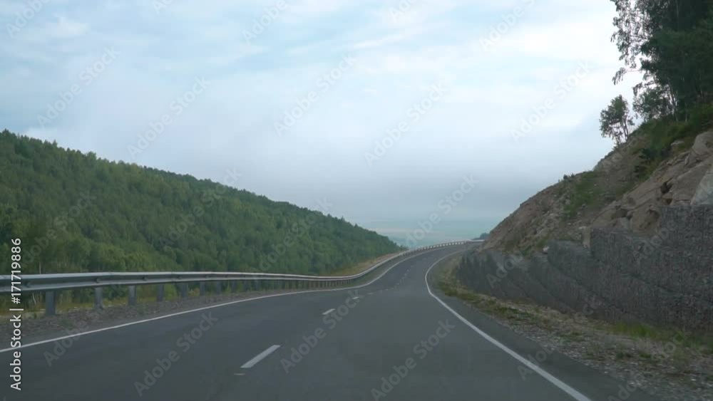 Driving on mountain road, car point of view. Slow motion Driving on mountain road, car point of view. Slow motion