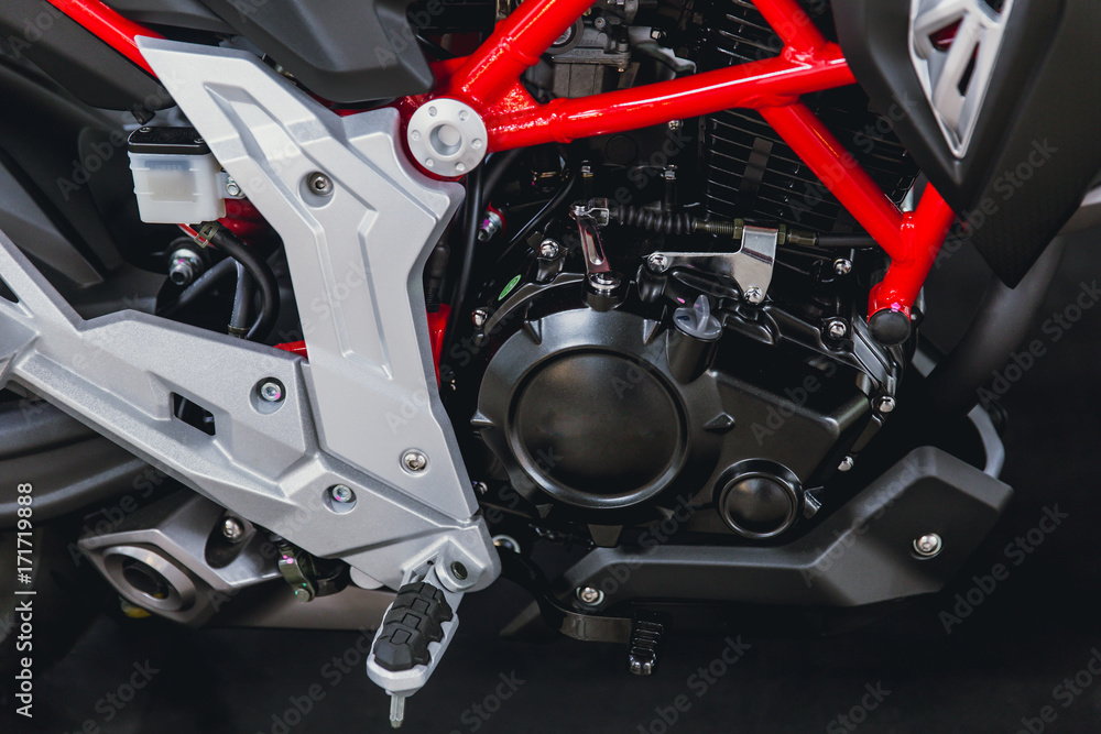 closeup small sport racing modern motobike or motorcycle engine closeup small sport racing modern motobike or motorcycle engine