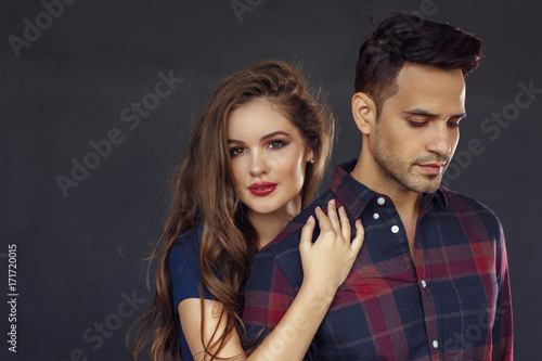 Fashion portrait of a beautiful couple, man and woman brunette