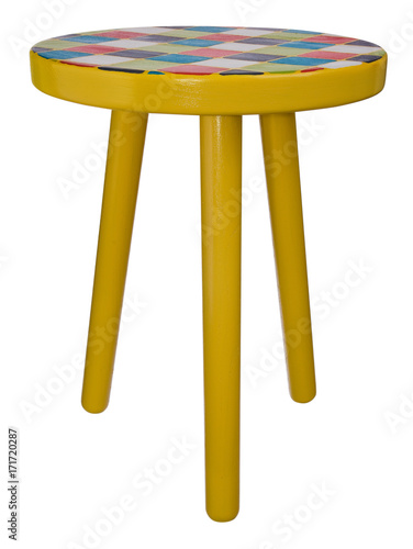 Handmade stool wooden yellow. Round seat wooden, painted in multicolored squares. photo