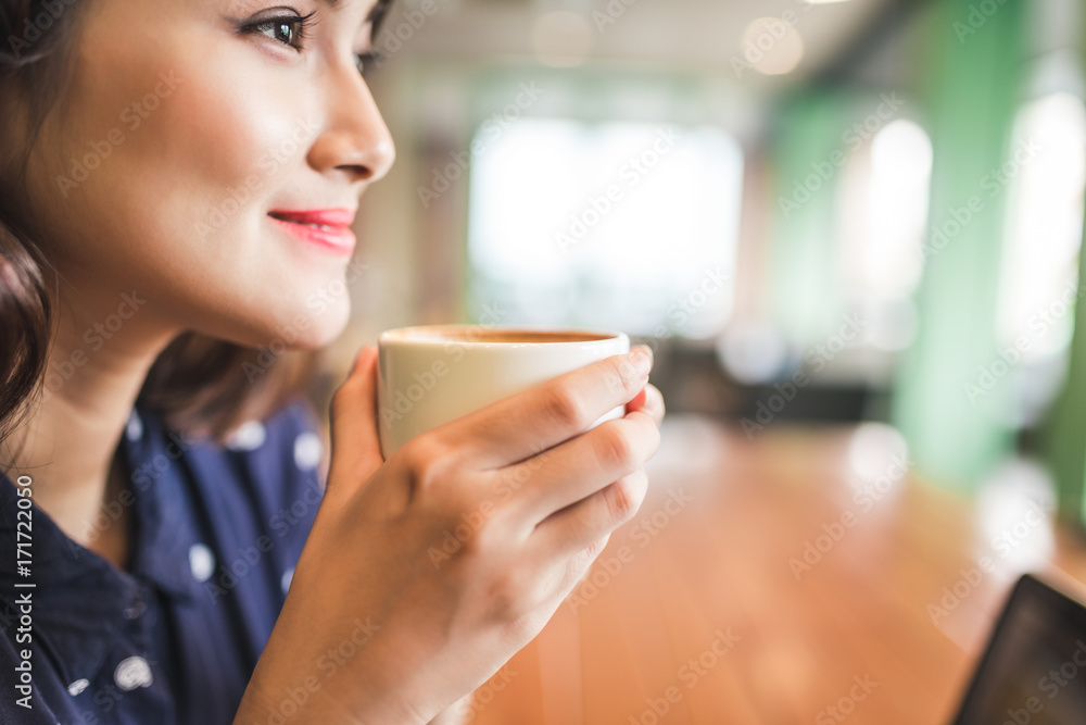 Portrait of happy young business woman with mug in hands, selective focus. Portrait of happy young business woman with mug in hands, selective focus.