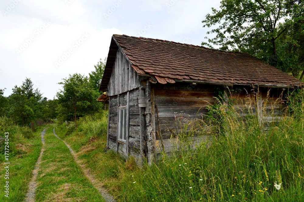 wooden house near the road wooden house near the road