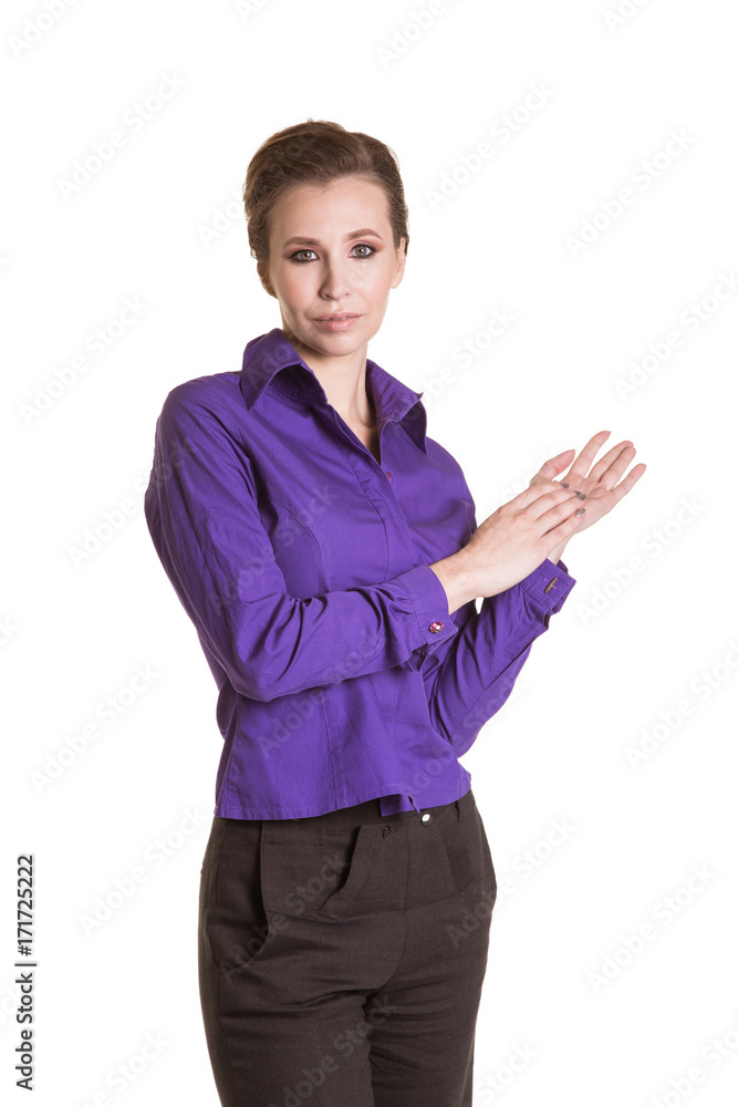 Adult business woman rubs his hands. Purple shirt. White background Adult business woman rubs his hands. Purple shirt. White background