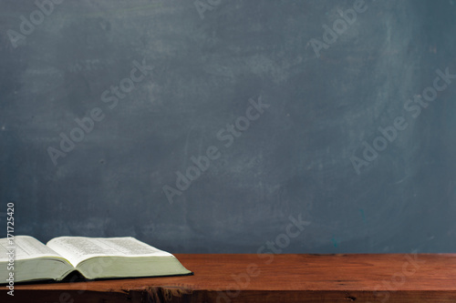 Bible on an old table. Beautiful background.Religion concept. photo