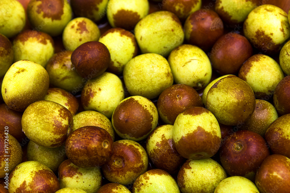 brown and green jujube fresh fruit background brown and green jujube fresh fruit background