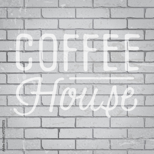 Hand drawn lettering slogan on brick wall background