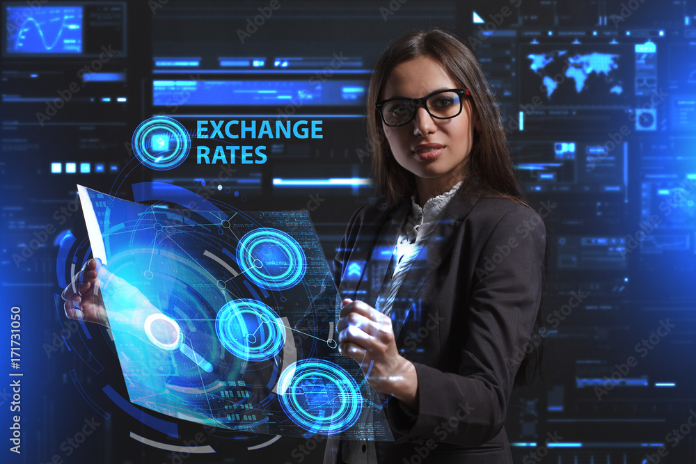 The concept of business, technology, the Internet and the network. A young entrepreneur working on a virtual screen of the future and sees the inscription: Exchange rates The concept of business, technology, the Internet and the network. A young entrepreneur working on a virtual screen of the future and sees the inscription: Exchange rates