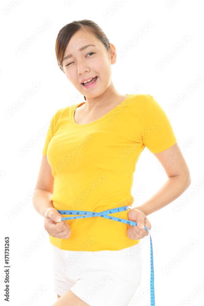 腹囲を測る女性 腹囲を測る女性