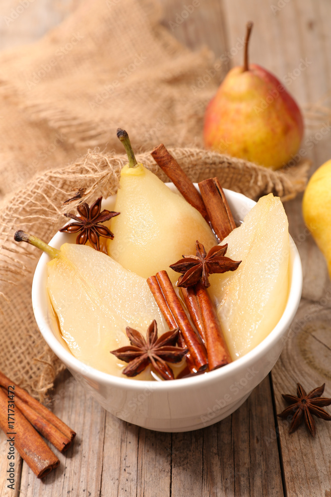 poached pear with syrup and spices