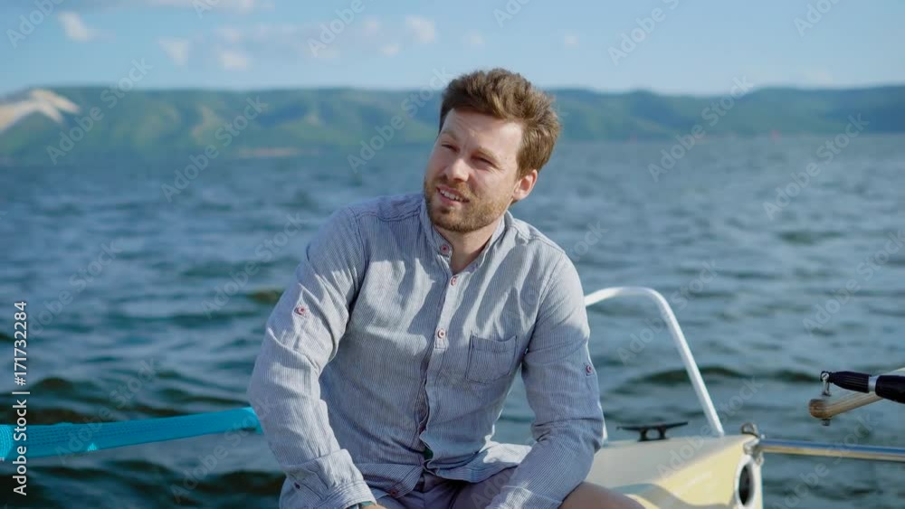 Pensive man on yacht sitting and enjoying views of sea Pensive man on yacht sitting and enjoying views of sea