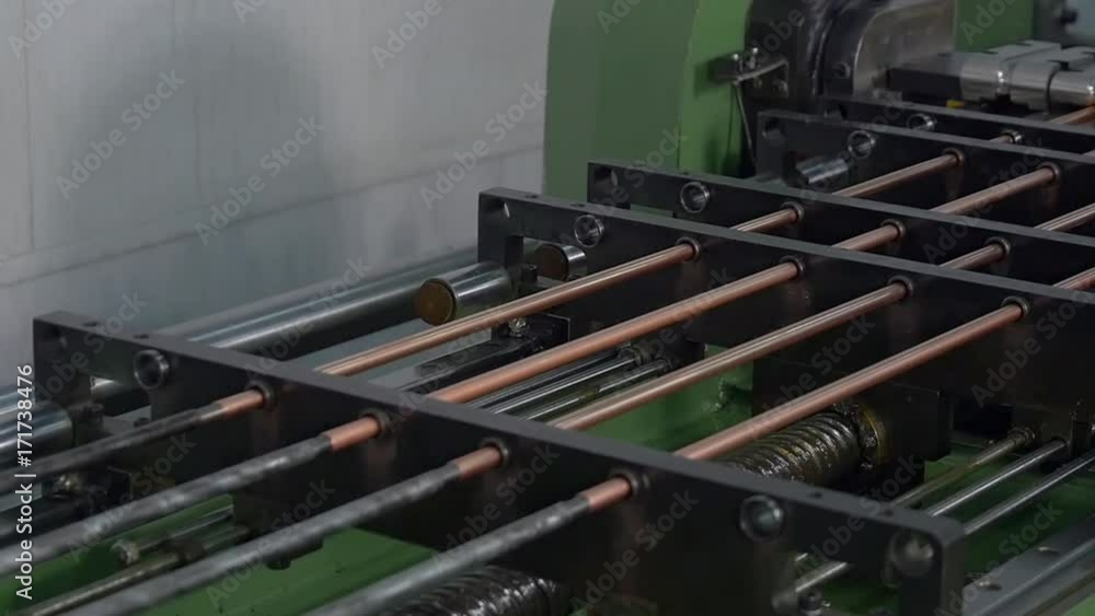 Manufacture of metal tubes on industrial CNC machine in factory slow motion. Automation of work. Refrigeration and ventilation industrial equipment and air conditioners. Modern technologies. Manufacture of metal tubes on industrial CNC machine in factory slow motion. Automation of work. Refrigeration and ventilation industrial equipment and air conditioners. Modern technologies.
