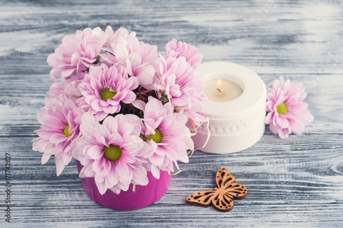 Pink chrysanthemum with candle